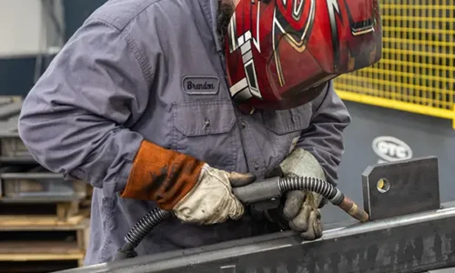 employee welding at kinninger custom fabrication